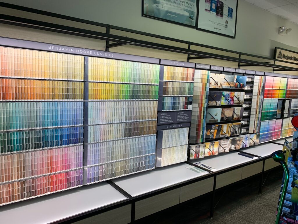 image of paint swatches in various colors displayed on wall in store