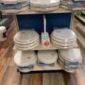 image of store display shelves carrying toilet seats and cleaning brushes